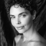 Dark-curly haired woman